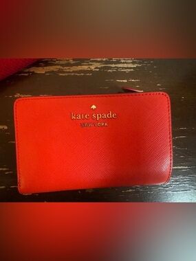 kate spade red zip-around saffiano leather wallet with gold logo